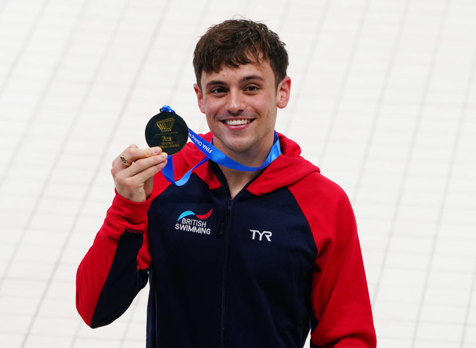 Diving - FINA Diving World Cup 2021 and Tokyo 2020 Olympics Aquatics Test Event - Tokyo Aquatics Centre, Tokyo, Japan - May 4, 2021  Gold medallist, Britain's Tom Daley poses with his medal after winning the men's 10m platform final REUTERS/Naoki Ogura