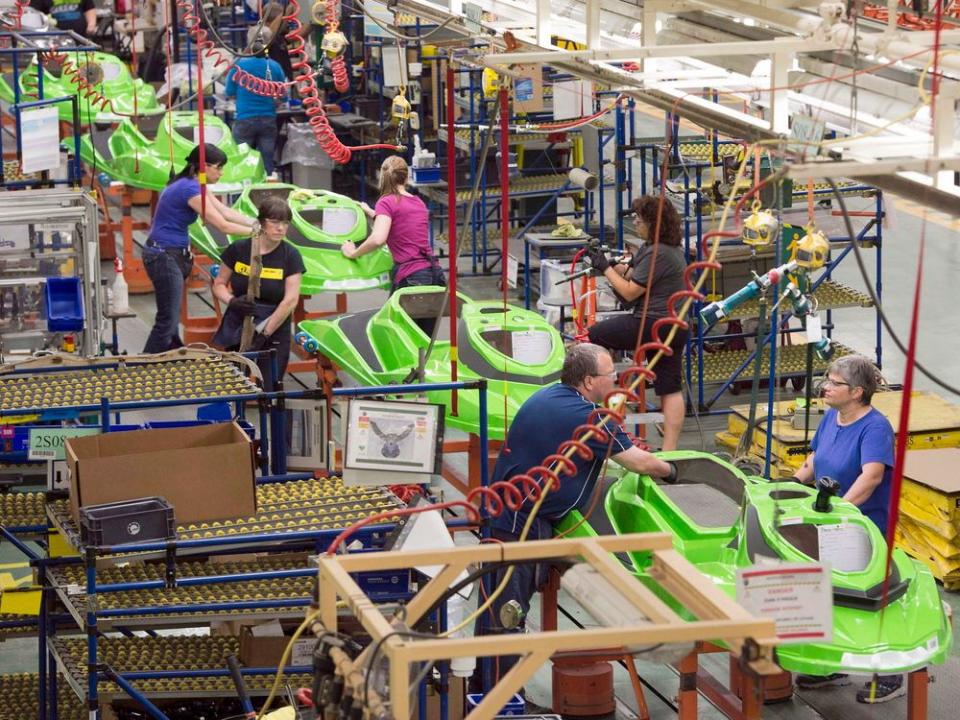  Employees work on the SeaDoo assembly line at the Bombardier Recreational Products plant in Valcourt, Que.