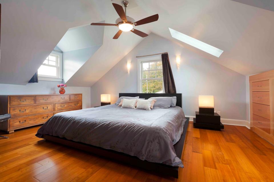 Attic Bedroom with ceiling fan