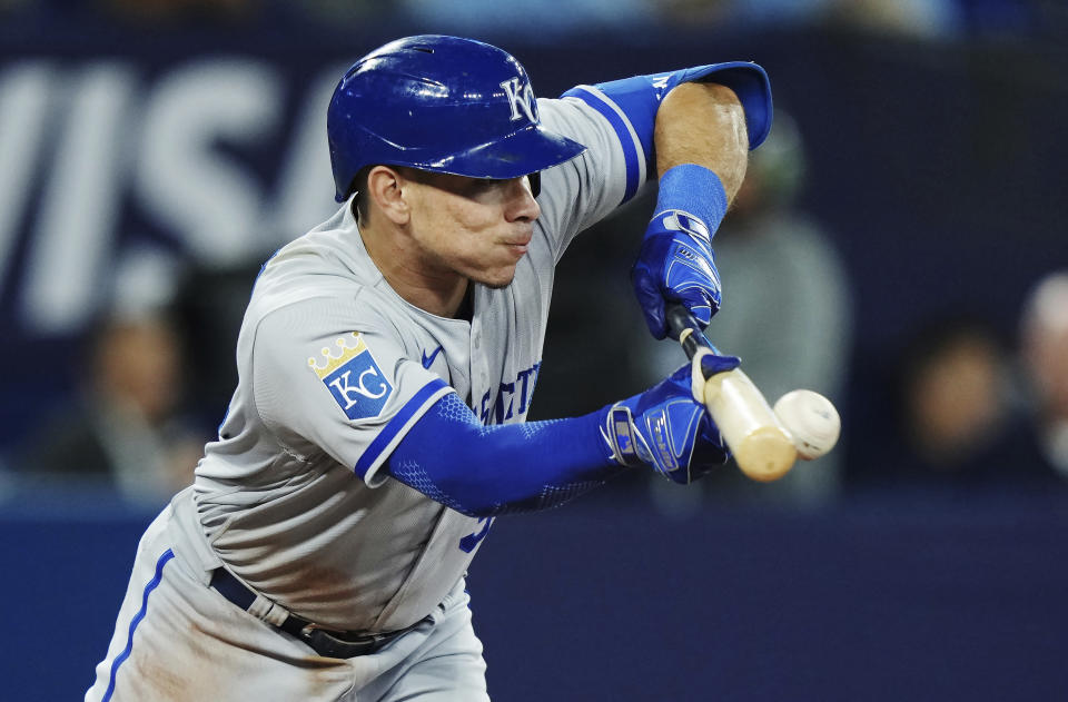 Kansas City Royals' Freddy Fermin bunts for a single against the Toronto Blue Jays during the fifth inning of a baseball game Friday, Sept. 8, 2023, in Toronto. (Nathan Denette/The Canadian Press via AP)