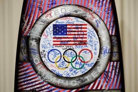 A surf board signed by U.S. Olympic and Paralympics teams members is seen to be presented President Barack Obama at the White House in Washington, U.S., September 29, 2016. REUTERS/Yuri Gripas