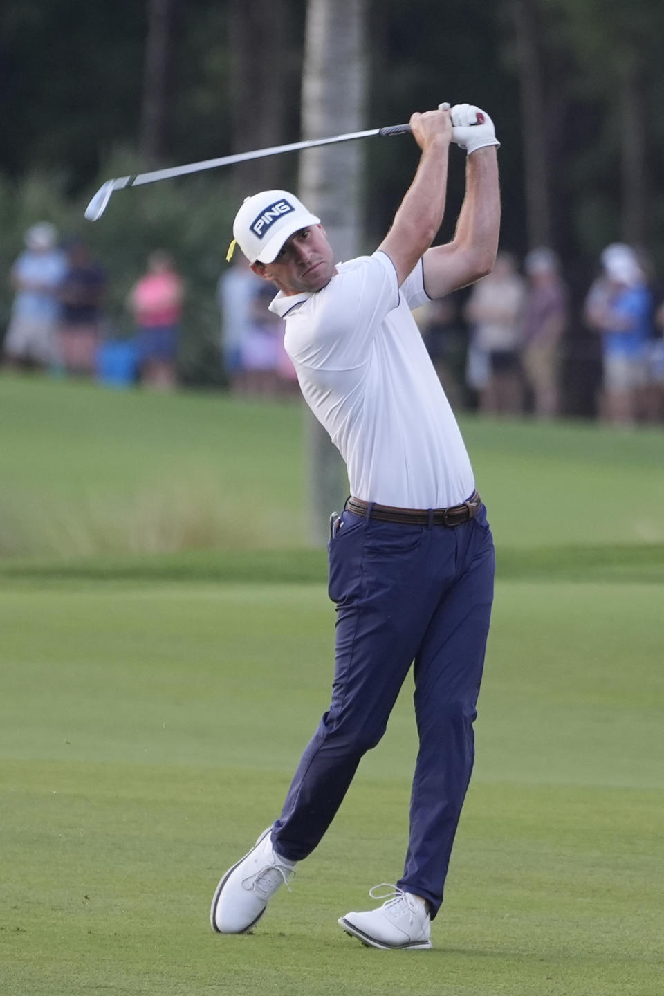 Austin Eckroat hits from the third fairway during the final round of the Cognizant Classic golf tournament, Sunday, March 3, 2024, in Palm Beach Gardens, Fla. The tournament will continue Monday due to a 3 1/2-hour weather delay. (AP Photo/Marta Lavandier)