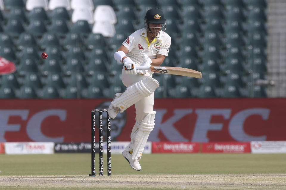 Australia's David Warner bats on the first day of the third test match between Pakistan and Australia at the Gaddafi Stadium in Lahore, Pakistan, Monday, March 21, 2022. Australia won the toss and elected to bat first. (AP Photo/K.M. Chaudary)