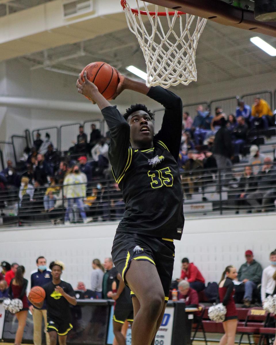 Walnut Hills center Tyler McKinley warms up before the game between Walnut Hills and Turpin high schools at Turpin High School Jan. 7, 2022.