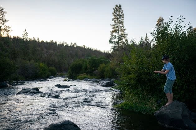 A man fly fishes along the Deschutes River in Bend, Oregon, in August. McLeod-Skinner hopes that her roots in central Oregon will give her an edge over Schrader. (Photo: Nathan Howard/Associated Press)