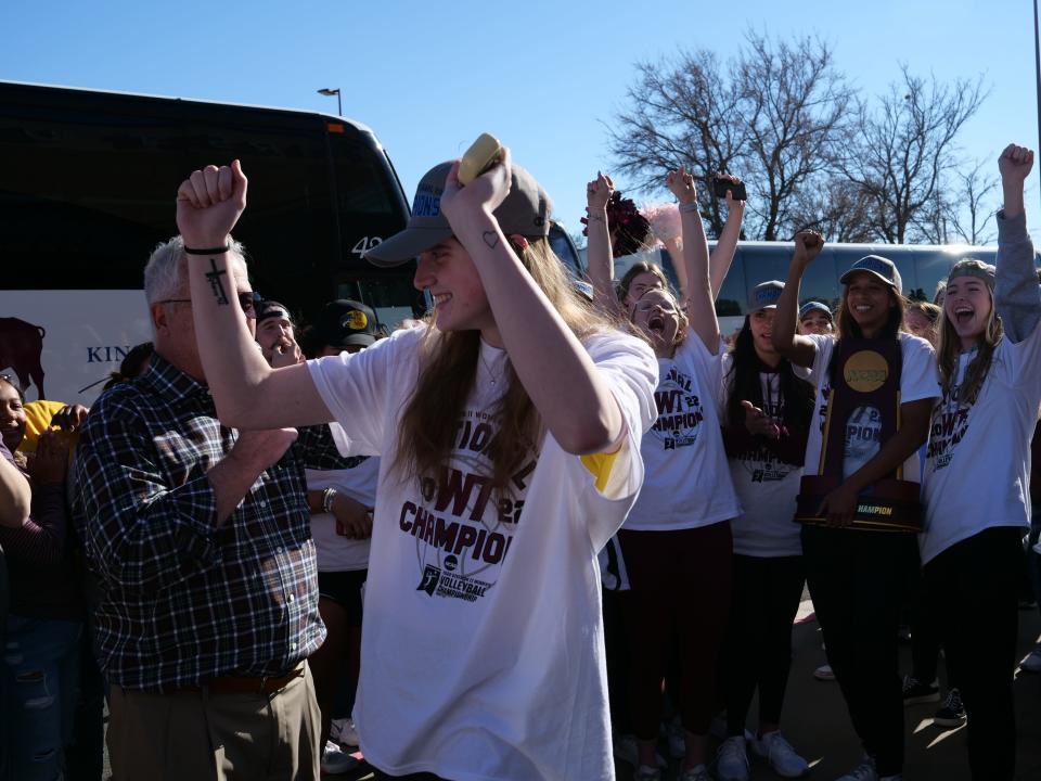 WT's Taytum Stow raises her arms in celebration at the volleyball team returns from winning the National Championship on Monday, Dec. 5, 2022.