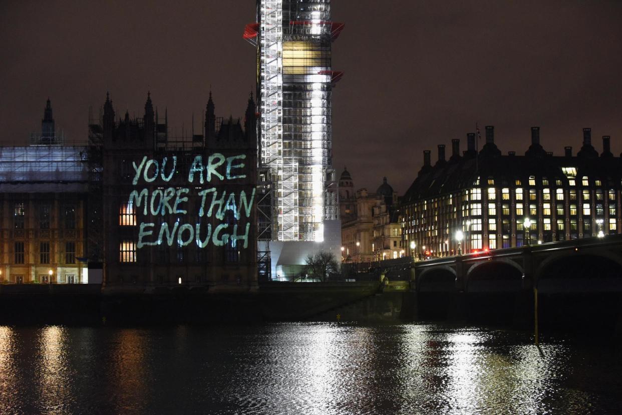 Messages are projected onto the Houses of Parliament to mark the start of International Women's Day on March 7, 2018: Getty Images for GladLife Ltd