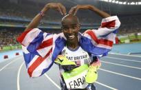 2016 Rio Olympics - Athletics - Final - Men's 5000m Final - Olympic Stadium - Rio de Janeiro, Brazil - 20/08/2016. Mo Farah (GBR) of Britain celebrates after winning the gold medal. REUTERS/Kai Pfaffenbach