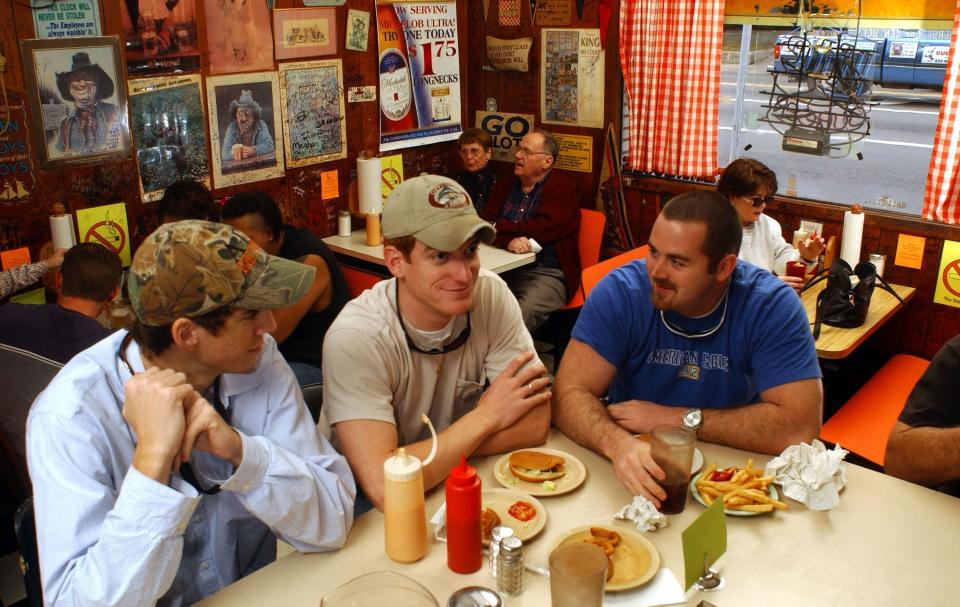 --12-29-02, 4a(Bruce Graner@PensacolaNewsJournal.com--Jerry's Drive In isn't waiting for the state to finalize its new constitutional ban on workplace smoking. The Pensacola restaurant has banned all smoking inside. From left, Ellis Bullock IV, Brian Morris and Dylan Stackpole enjoy lunch in what used to be the smoking section of Jerry's Drive In.--"No smoking" signs are now prevalent inside Jerry's Drive In.