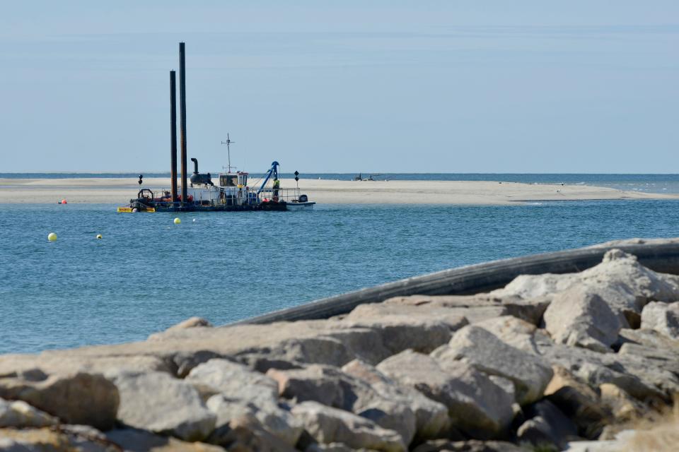 In this March 2022 file photo, the Barnstable County dredge, Sand Shifter, works the Stage Harbor approach channel.  The dredge project, run by superintendent Jason Bevis and crew, had an April 1 deadline to be completed before piping plover restrictions start, according to dredge administrator Ken Cirillo said. The target volume is 30,000 cubic yards.