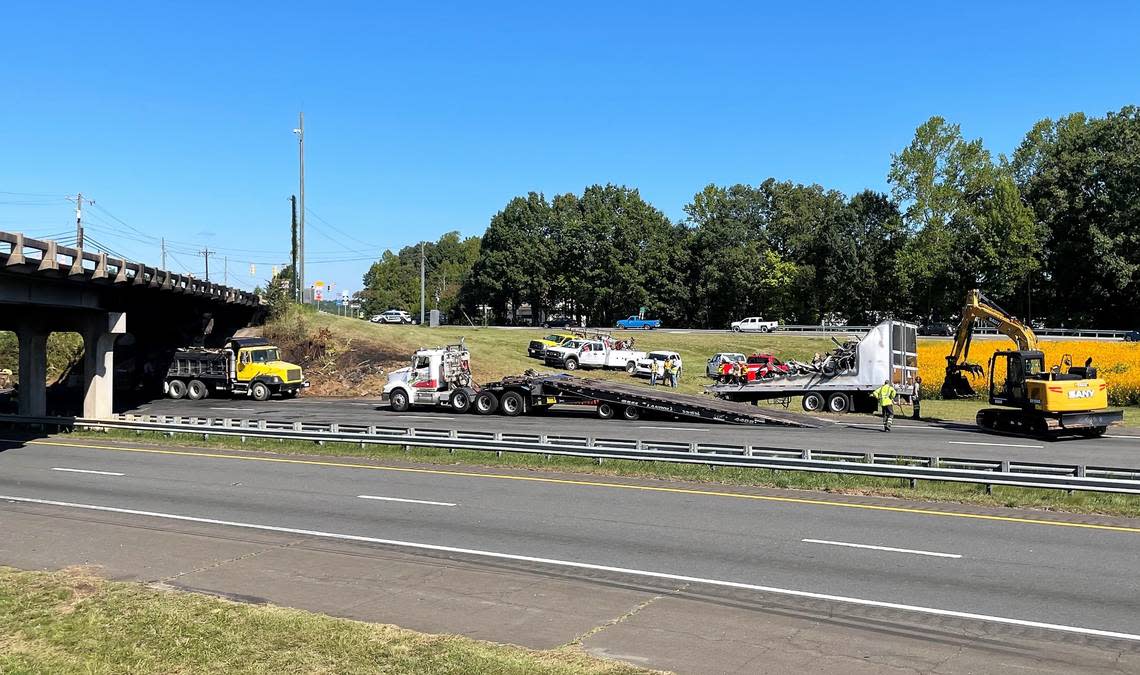 N.C. Highway Patrol, Orange County Sheriff’s Office and Hillsborough Police were helping to direct traffic Wednesday morning, Aug. 14, 2022, at Interstate 85 and NC 86 in Hillsborough as the remains of a tractor-trailer were being loaded onto a truck for removal. Tammy Grubb/tgrubb@heraldsun.com