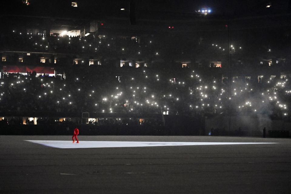 Kanye West prowls the Mercedes-Benz Stadium floor during the 'Donda' listening event.