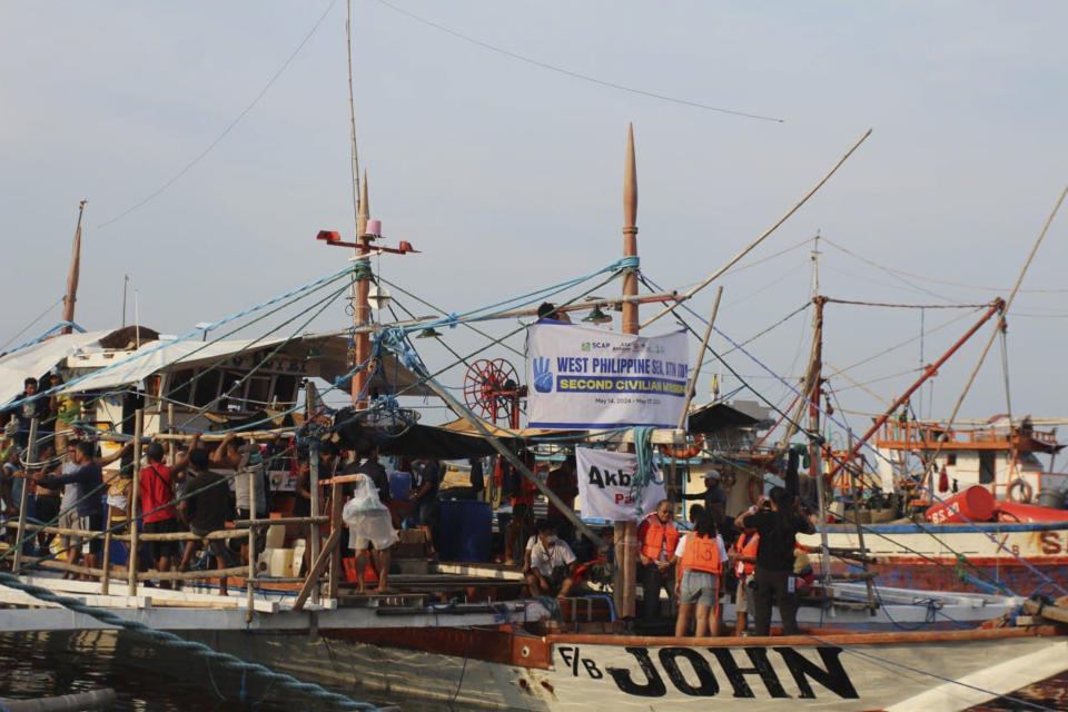 In this photo provided by Atin-Ito/Akbayan Party, activists and volunteers on fishing boats begin their journey at Masinloc, Zambales province, northwestern Philippines on Wednesday May 15, 2024. A flotilla of about 100 mostly small fishing boats led by Filipino activists sailed Wednesday to a disputed shoal in the South China Sea, where Beijing's coast guard and suspected militia ships have used powerful water cannons to ward off what they regard as intruders. (Atin-Ito/Akbayan Party via AP)