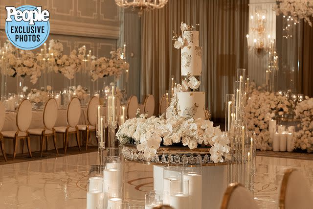 <p>MOOD Photography and Video</p> The newlyweds served a white chocolate, pearl and gold cake from Sweet Traders