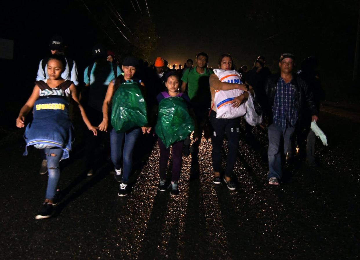 Honduran migrants head for the United States in 2019. <a href="https://www.gettyimages.com/detail/news-photo/honduran-migrants-part-of-the-second-caravan-to-the-united-news-photo/1082946788?adppopup=true" rel="nofollow noopener" target="_blank" data-ylk="slk:Orlando Sierra/AFP via Getty Images;elm:context_link;itc:0;sec:content-canvas" class="link ">Orlando Sierra/AFP via Getty Images</a>