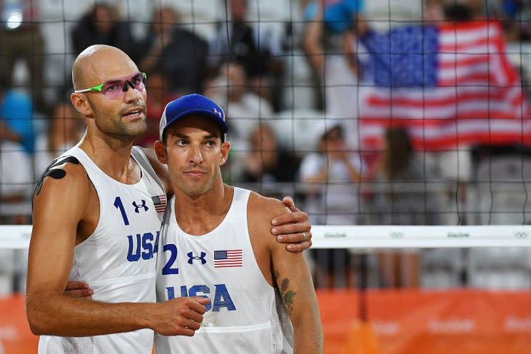 USA's Phil Dalhausser (L) and Nicholas Lucena celebrate after winning the men's beach volleyball qualifying match between the USA and Tunisia at the Beach Volley Arena in Rio de Janeiro on August 7, 2016, for the Rio 2016 Olympic Games. / AFP / Leon NEAL (Photo credit should read LEON NEAL/AFP/Getty Images)