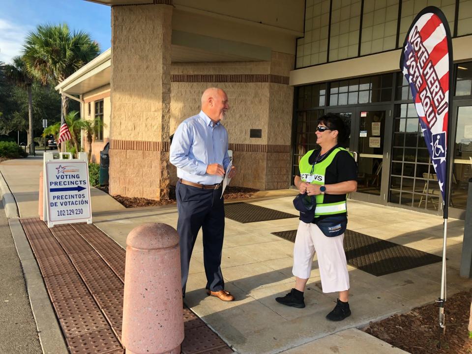 Rob Rains, president of United Way of Brevard, chats with a poll worker outside the Walter Butler Community Center in Cocoa after casting his ballot the first hour of voting in Tuesday's primary. He said of voting: "Everybody should vote ... people have died for our right to vote. I'm proud to wear my 'I Voted' sticker all day."