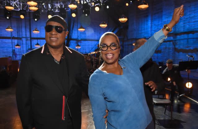 Stevie Wonder and Oprah cheer on callers during the telethon