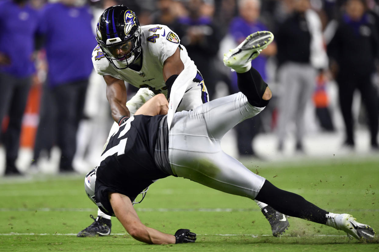 Marlon Humphrey of the Baltimore Ravens tackles Hunter Renfrow of the Las Vegas Raiders