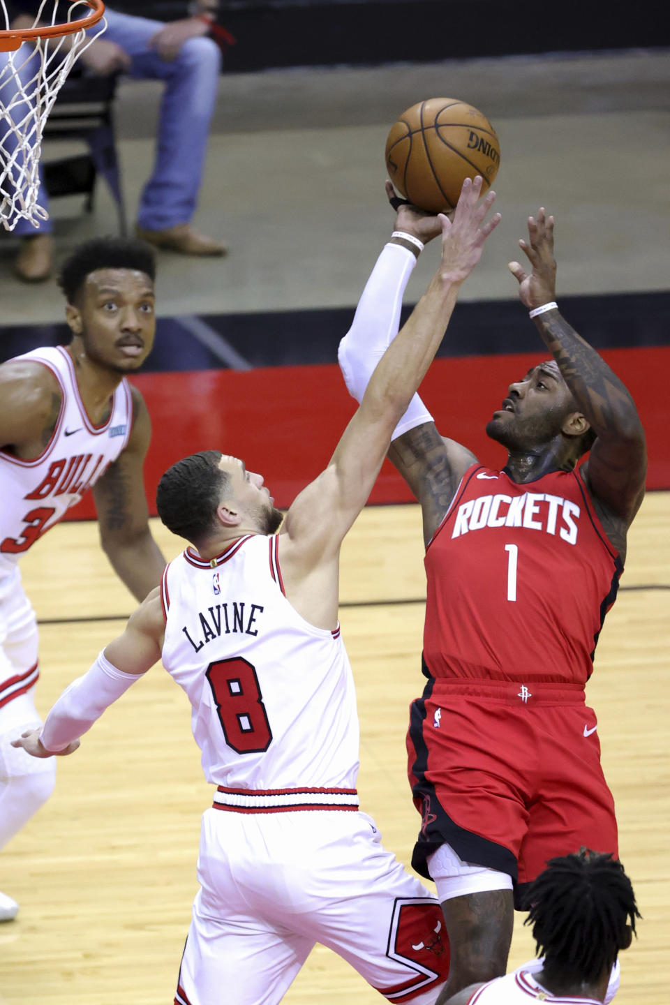 Houston Rockets' John Wall (1) puts up a jump shot against Chicago Bulls' Zach LaVine (8) during the first quarter of an NBA basketball game Monday, Feb. 22, 2021, in Houston. (Carmen Mandato/Pool Photo via AP)