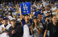 Oct 15, 2017; Los Angeles, CA, USA; Los Angeles Dodgers fans celebrate after defeating the Chicago Cubs in game two of the 2017 NLCS playoff baseball series at Dodger Stadium. Mandatory Credit: Jayne Kamin-Oncea-USA TODAY Sports