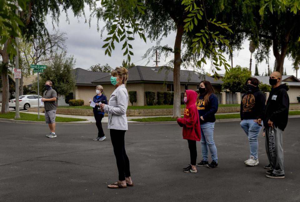 Neighbors gather to sing "Amazing Grace"