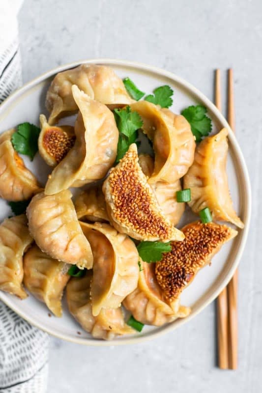 <p>The Curious Chickpea</p><p>These delicious gochujang tofu dumplings have a spicy Korean-inspired filling and make a great snack or appetizer, or you can eat more and make it a meal! Their crispy sesame seed coated bottoms make them extra special.</p><p><strong>Get the recipe: <a href="https://www.thecuriouschickpea.com/gochujang-tofu-dumplings/" rel="nofollow noopener" target="_blank" data-ylk="slk:Gochujang Tofu Dumplings;elm:context_link;itc:0;sec:content-canvas" class="link rapid-noclick-resp"><em>Gochujang Tofu Dumplings</em></a></strong></p>