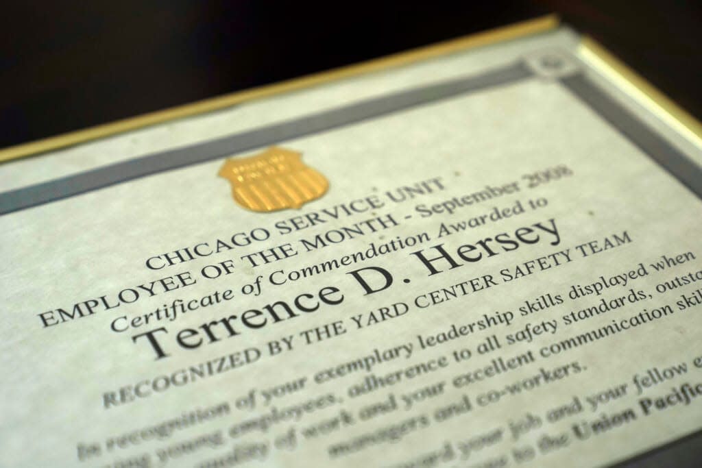 Terrence Hersey’s Union Pacific Railroad September 2008 employee of the month certificate sits framed at his home Friday, June 17, 2022, in South Holland, Ill. (AP Photo/Charles Rex Arbogast)