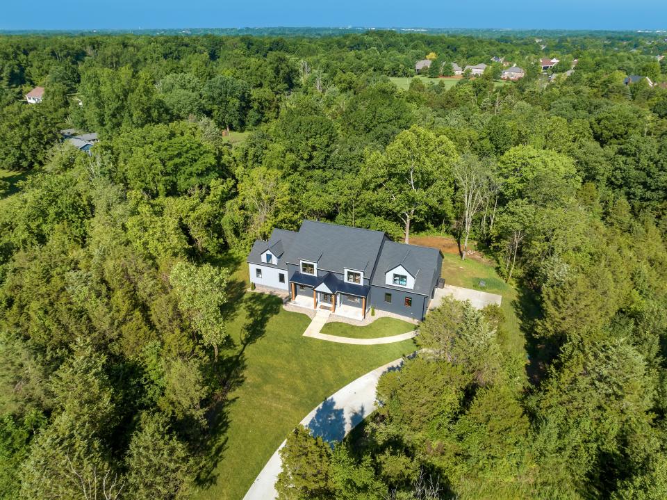 This modern farmhouse-style home built by the Eldridge Company in Louisville is set more than 1,200 feet from the main road.