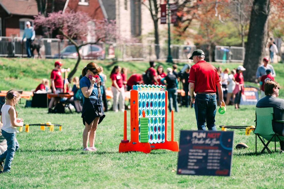 Attendees play a large version of Connect Four in Dunn Meadow during Eclipse Day on Monday, April 8, 2024.