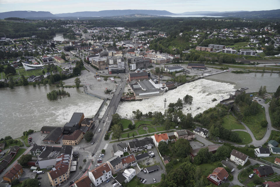 Honefoss hit by floodwater in southeast Norway, Friday Aug. 11. 2023. More evacuations were being considered Friday in southeastern Norway, where the level of water in swollen rivers and lakes continued to grow after days of torrential rain. (NTB via AP)