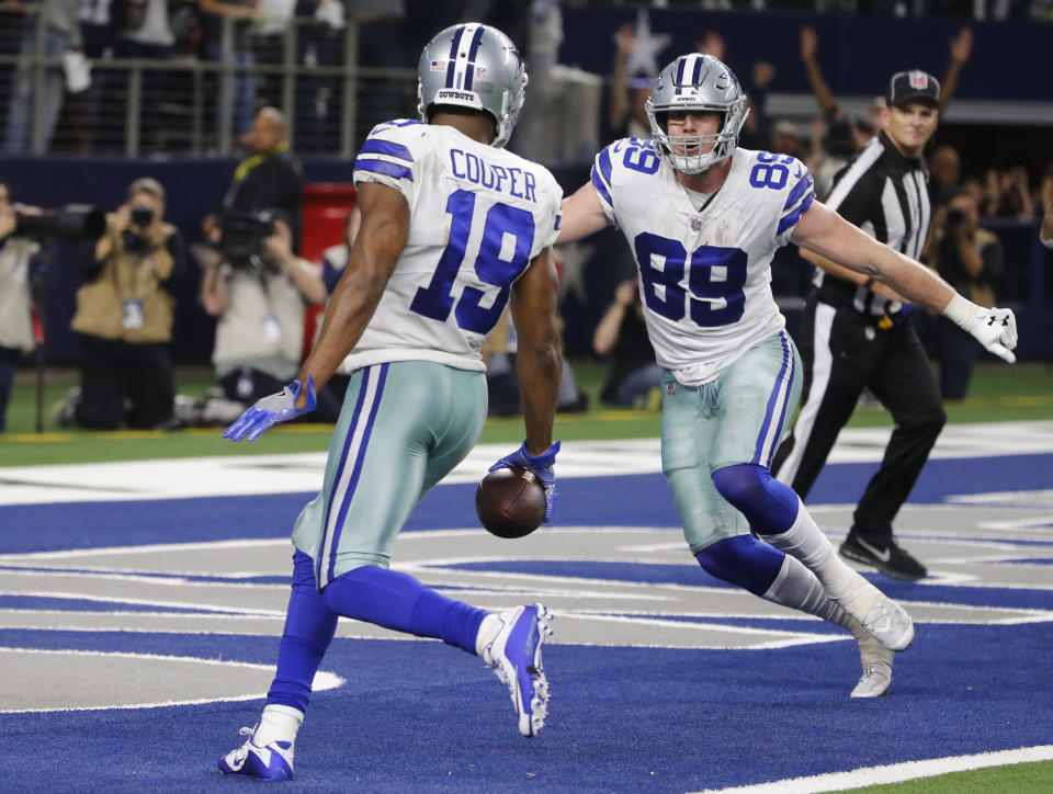 Dallas Cowboys wide receiver Amari Cooper (19) scores on a 15-yard catch against the Philadelphia Eagles in overtime of an NFL football game, in Arlington, Texas, Sunday, Dec. 9, 2018. (AP Photo/Michael Ainsworth)