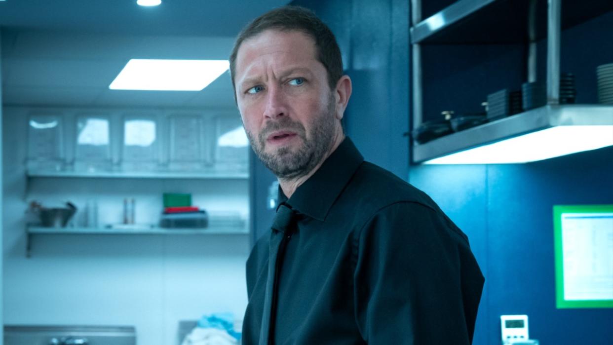  Ebon Moss-Bachrach as Richie standing in a kitchen in Season 2 of The Bear. 