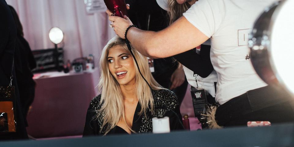 <p>Devon Windsor gets her hair blown out. </p>