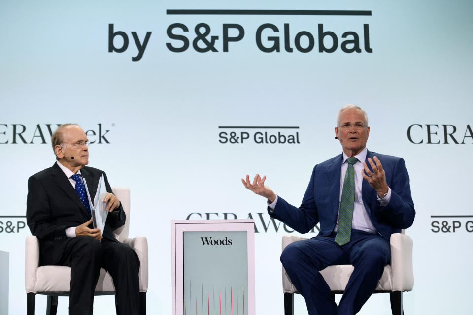 Exxon Mobil Chairman and CEO Darren Woods (R) speaks at the CERAWeek Oil Summit in Houston, Texas, March 18, 2024 (Photo by Mark Felix/AFP) (Photo by MARK FELIX/AFP) via Getty Images)