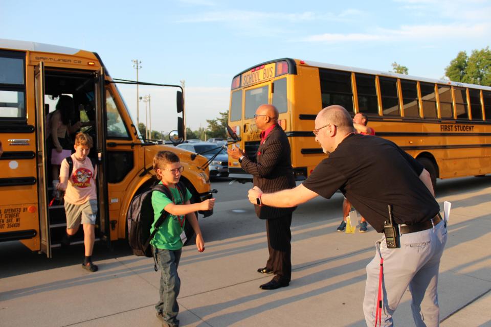 Edison Middle School Principal Brenden Whitfield and Green Bay School District Superintendent Claude Tiller great students on the first day of school on September 5, 2023, in Green Bay.