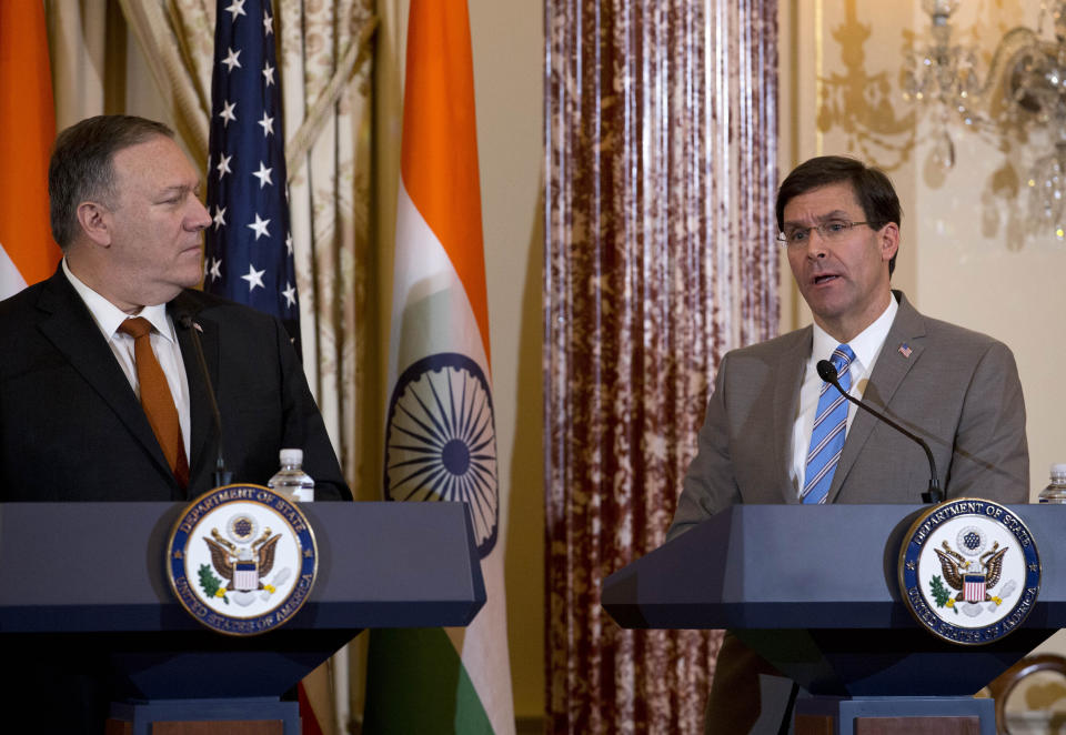 Secretary of Defense Mark Esper accompanied by Secretary of State Mike Pompeo speaks during a news conference after a bilateral meeting between the U.S. and India at the Department of State in Washington, Wednesday, Dec. 18, 2019. (AP Photo/Jose Luis Magana)