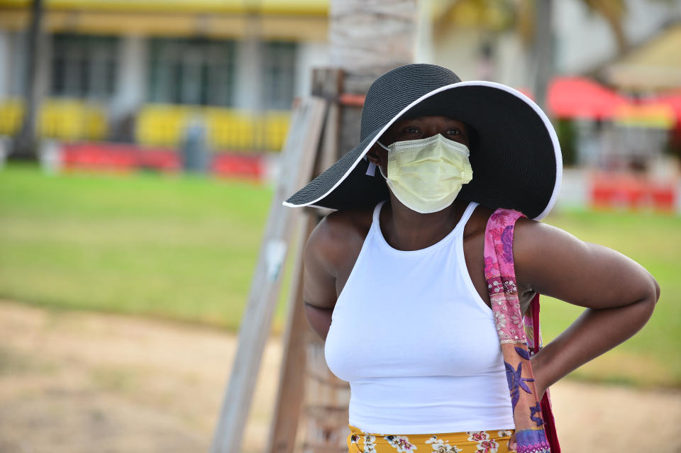 MIAMI BEACH, FL - JULY 06: A girl wearing a face mask with outdoor dining space on Ocean Drive will be permitted to stay open, while the indoor portion of the restaurant will be closed to patrons following a clarification from Mayor Carlos Gimenez, is seen on July 06, 2020 in Miami Beach, Florida. Miami Beach has mandated that masks be worn in public, where social distancing is not possible. With a surge in COVID-19 cases, Mayor Carlos Gimenez on Monday has ordered the closing of all restaurants, gyms and fitness centers, ballrooms and short-term vacation rentals. Mayor Gimenez will allow beaches to re-open on July 7th after being closed over the 4th of July weekend. (Photo by Johnny Louis/Getty Images)