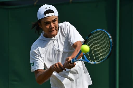 Japan's Taro Daniel hits a return