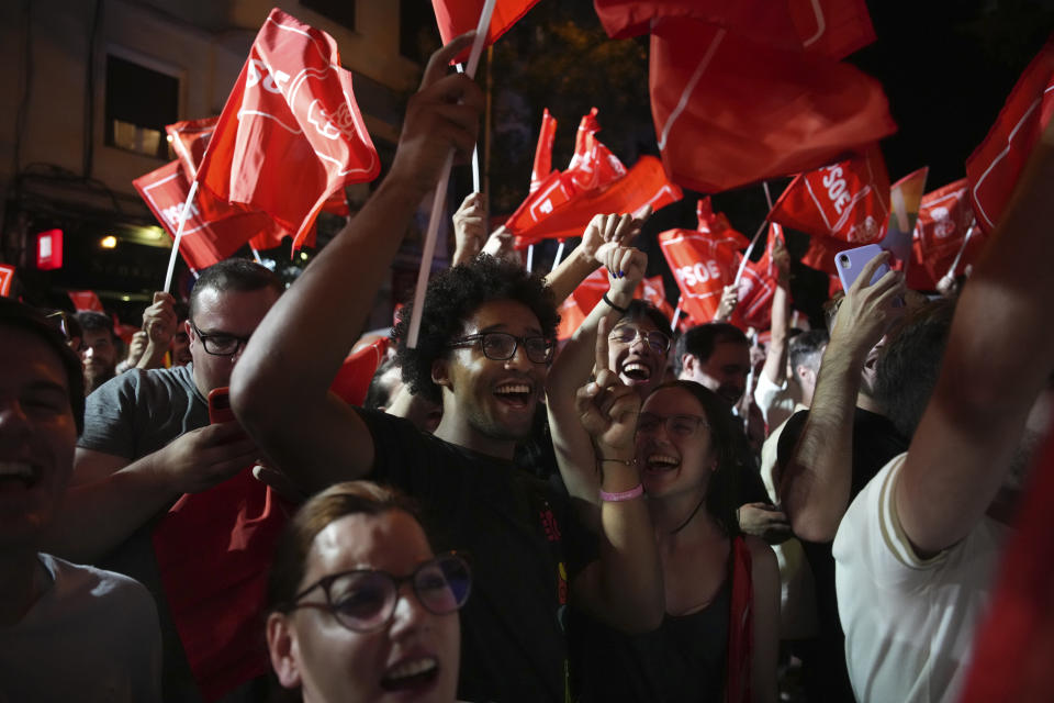 Socialist Workers' Party supporters cheer as they wait for Prime Minster and Socialist party leader Pedro Sanchez outside the party's headquarters in Madrid, Spain, Sunday July 23, 2023. Spain's conservative Popular Party is set to narrowly win the country's national election but without the majority needed to topple the coalition government of Socialist Prime Minister Pedro Sánchez. (AP Photo/Emilio Morenatti)