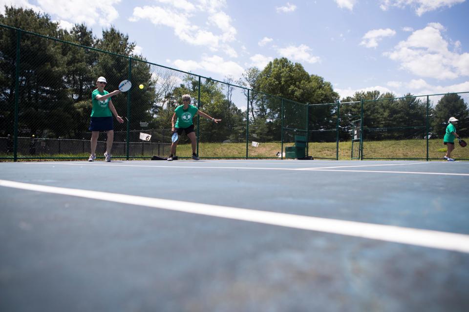 People play pickle ball at Deacons Walk Park Tuesday, May 17, 2022. 