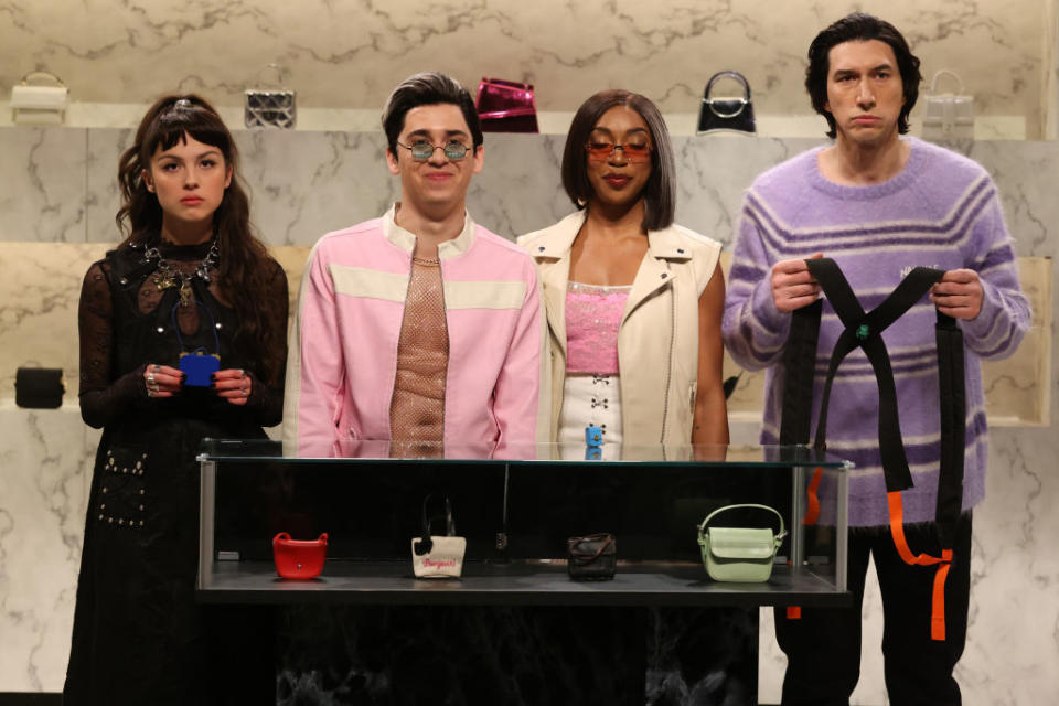 SATURDAY NIGHT LIVE -- "Adam Driver, Olivia Rodrigo" Episode 1851 -- Pictured: (l-r) Musical guest Olivia Rodrigo as Georgina, Marcello Hernández as Rogelio, Ego Nwodim as Marie Jose, and host Adam Driver as Kevin during the "Tiny Ass Bags" sketch on Saturday, December 9, 2023 -- (Photo by: Will Heath/NBC via Getty Images)