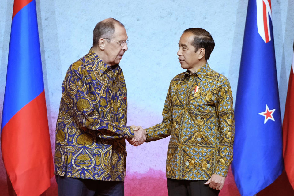 Indonesian President Joko Widodo, right, shakes hands with Russian Foreign Minister Sergey Lavrov during the courtesy calls of ministers at the Association of Southeast Asian Nations (ASEAN) Foreign Ministers' Meeting in Jakarta, Indonesia, Friday, July 14, 2023. (AP Photo/Achmad Ibrahim, Pool)