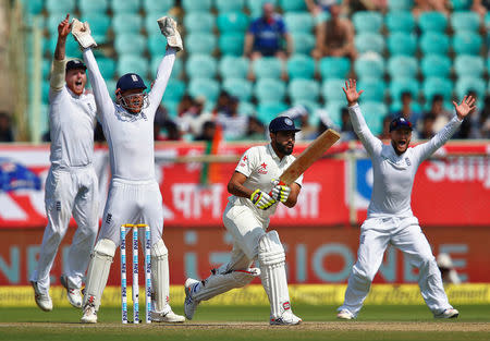 Cricket - India v England - Second Test cricket match - Dr. Y.S. Rajasekhara Reddy ACA-VDCA Cricket Stadium, Visakhapatnam, India - 18/11/16. England's players successfully appeals for India's Ravindra Jadeja (2nd R) dismissal. REUTERS/Danish Siddiqui