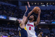 Detroit Pistons forward Braxton Key (8) shoots over Indiana Pacers guard Duane Washington Jr. (4) during the first half of an NBA basketball game in Indianapolis, Sunday, April 3, 2022. (AP Photo/Michael Conroy)