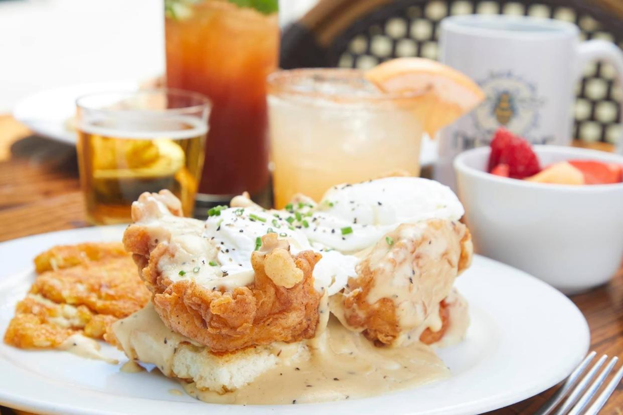 Nectar's Fried Chicken Benedict with Sawmill Gravy, Hash Browns and cocktails