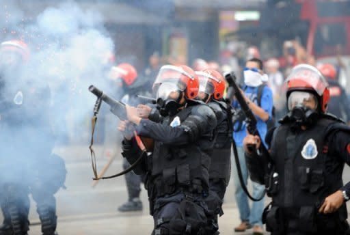 Police fire tear gas at protesters during a mass rally in Kuala Lumpur. A man who took part in weekend protests in the Malaysian capital demanding electoral reforms died due to breathing difficulties during the rally, the opposition said Sunday