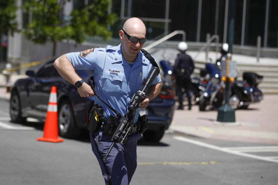 Law enforcement officers arrive near the scene of an active shooter on Wednesday, May 3, 2023 in Atlanta. Atlanta police said there had been no additional shots fired since the initial shooting unfolded inside a building in a commercial area with many office towers and high-rise apartments. (AP Photo/Alex Slitz)