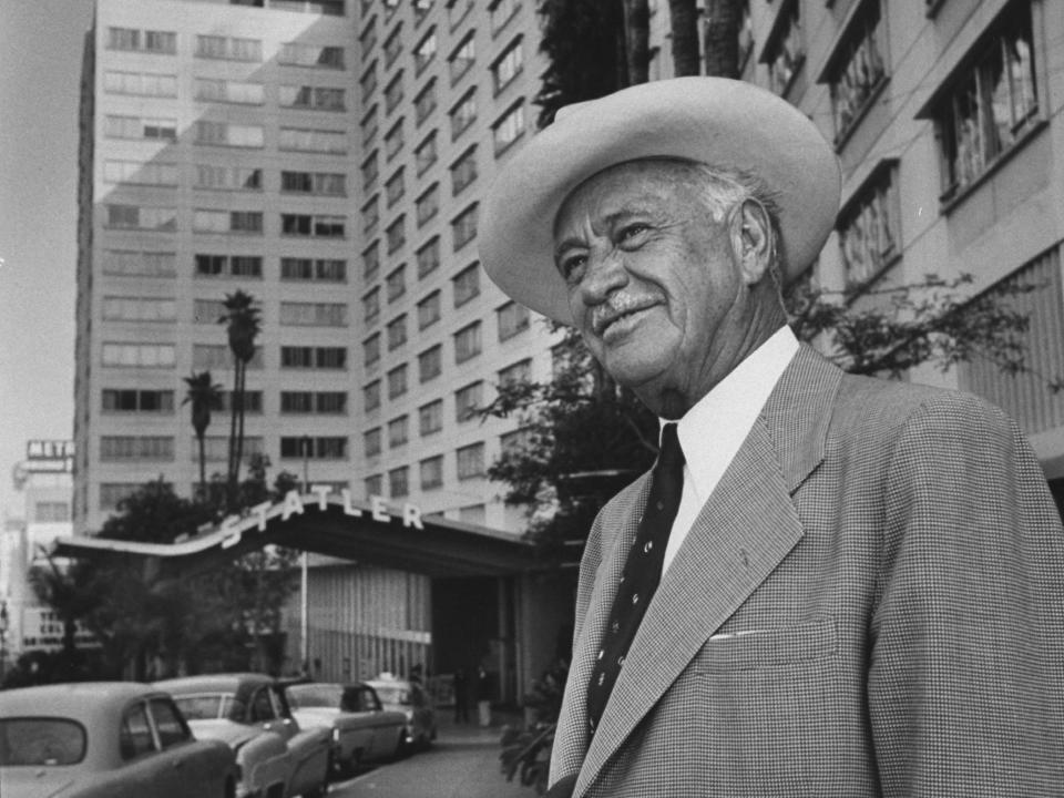 Conrad Hilton in front the of the Los Angeles Statler in 1954