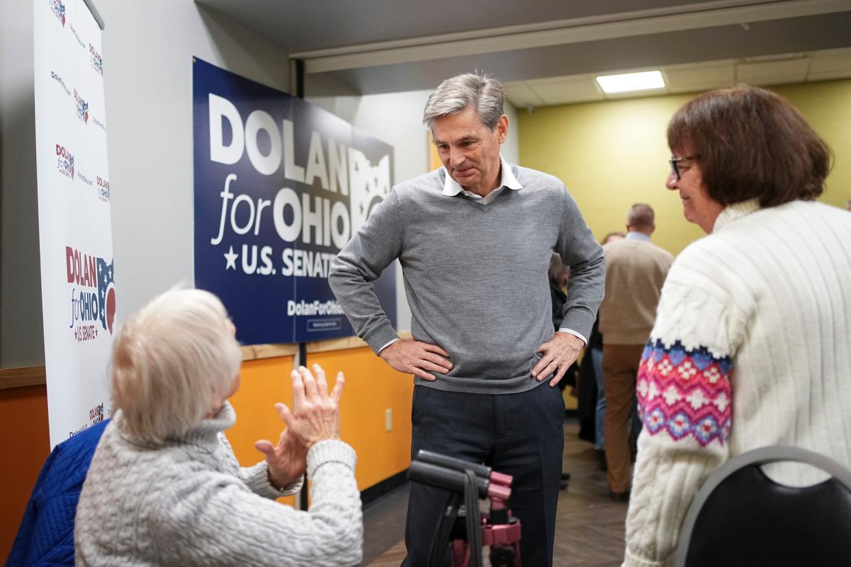 U.S. Senate candidate Matt Dolan speaks to supporters, Shirley Shepard, left, and her sister, Bev Raptoulis, during a campaign event at Ten Pin Alley in Hilliard on Jan. 18.